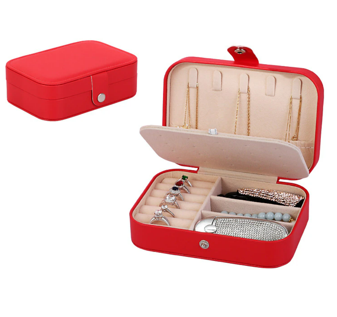 Jewelry box open, displaying necklace hooks and elastic pouch.
