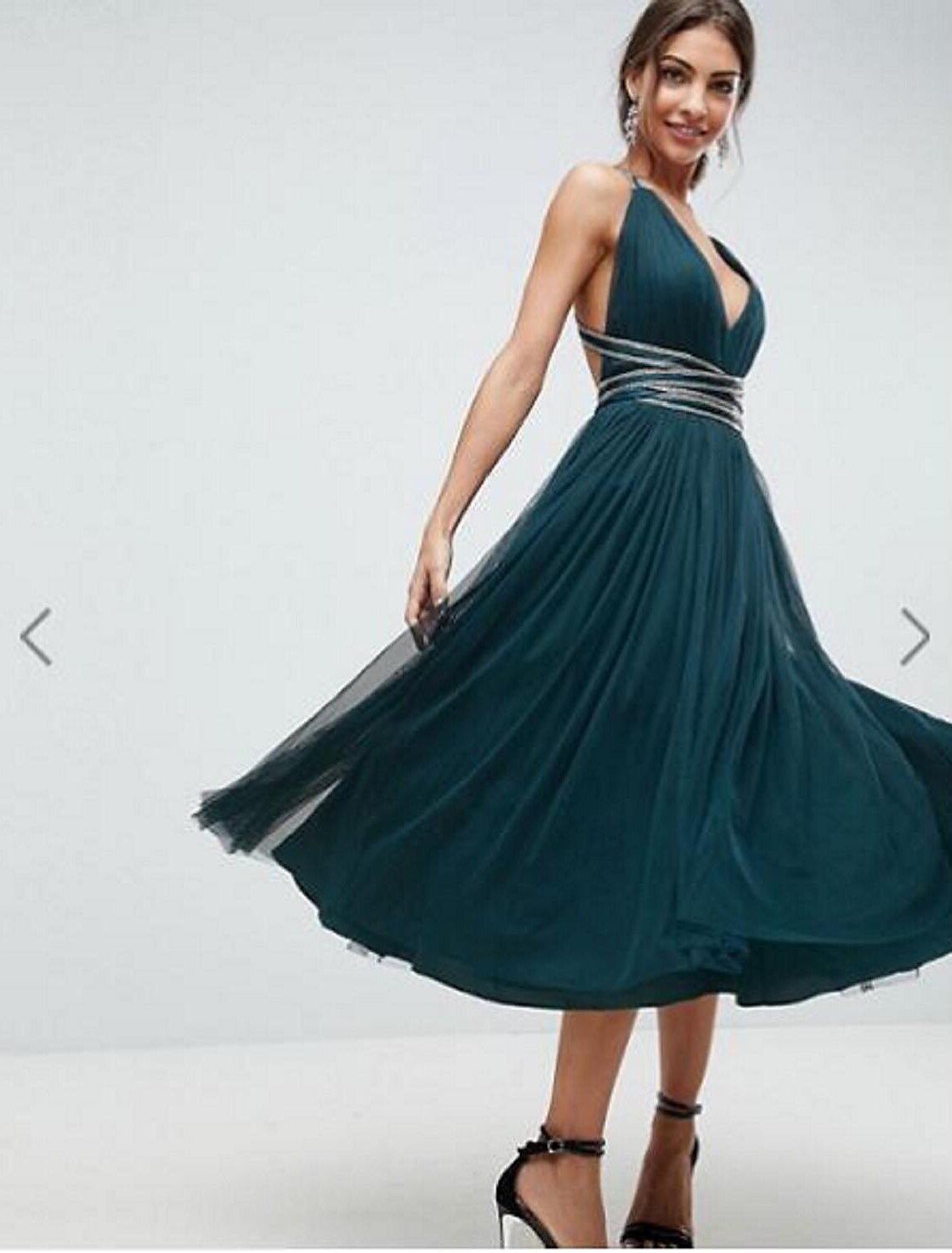 Elegant Princess A-Line bridesmaid dress with plunging neck, tea length, and sequin details.