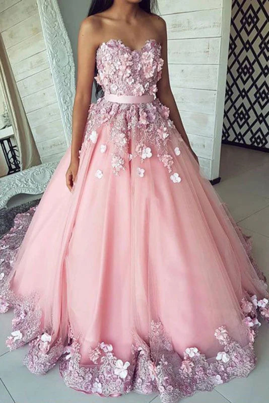 Elegant sweetheart tulle prom dress with floral appliques and a sweep train.