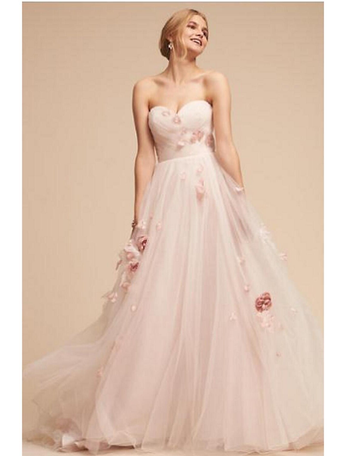 Princess sweetheart sleeveless tulle wedding gown with appliques and sweep train.