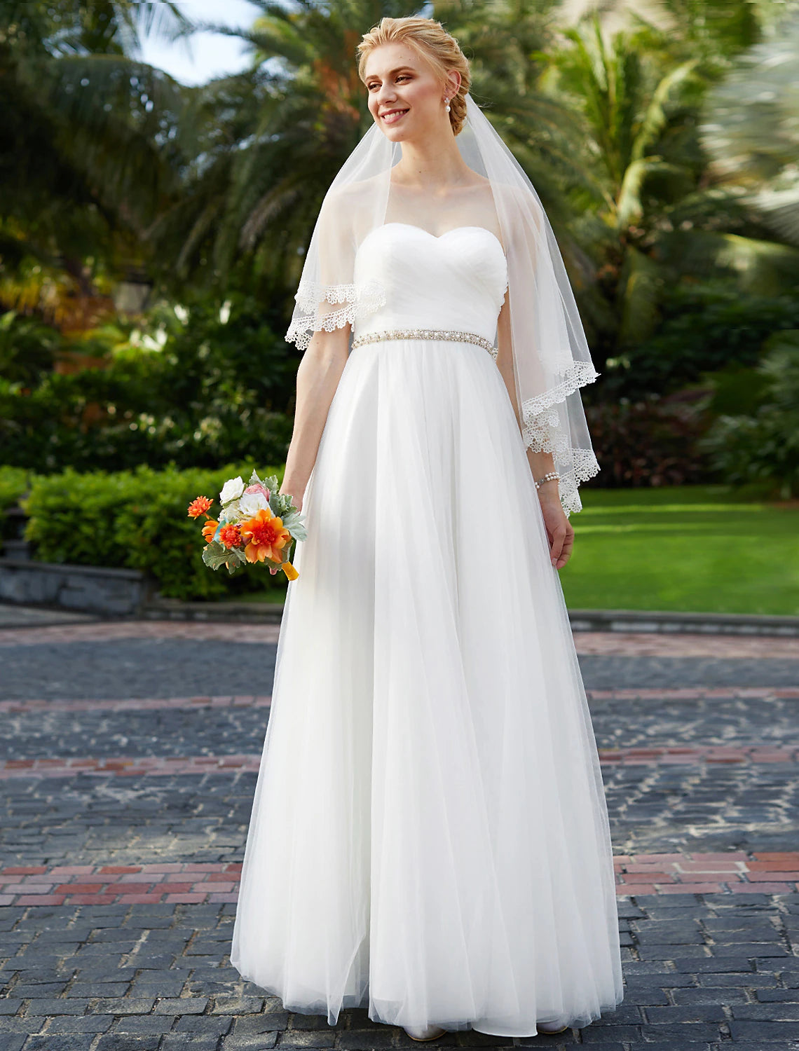 Princess sweetheart strapless chiffon wedding gown with beading.
