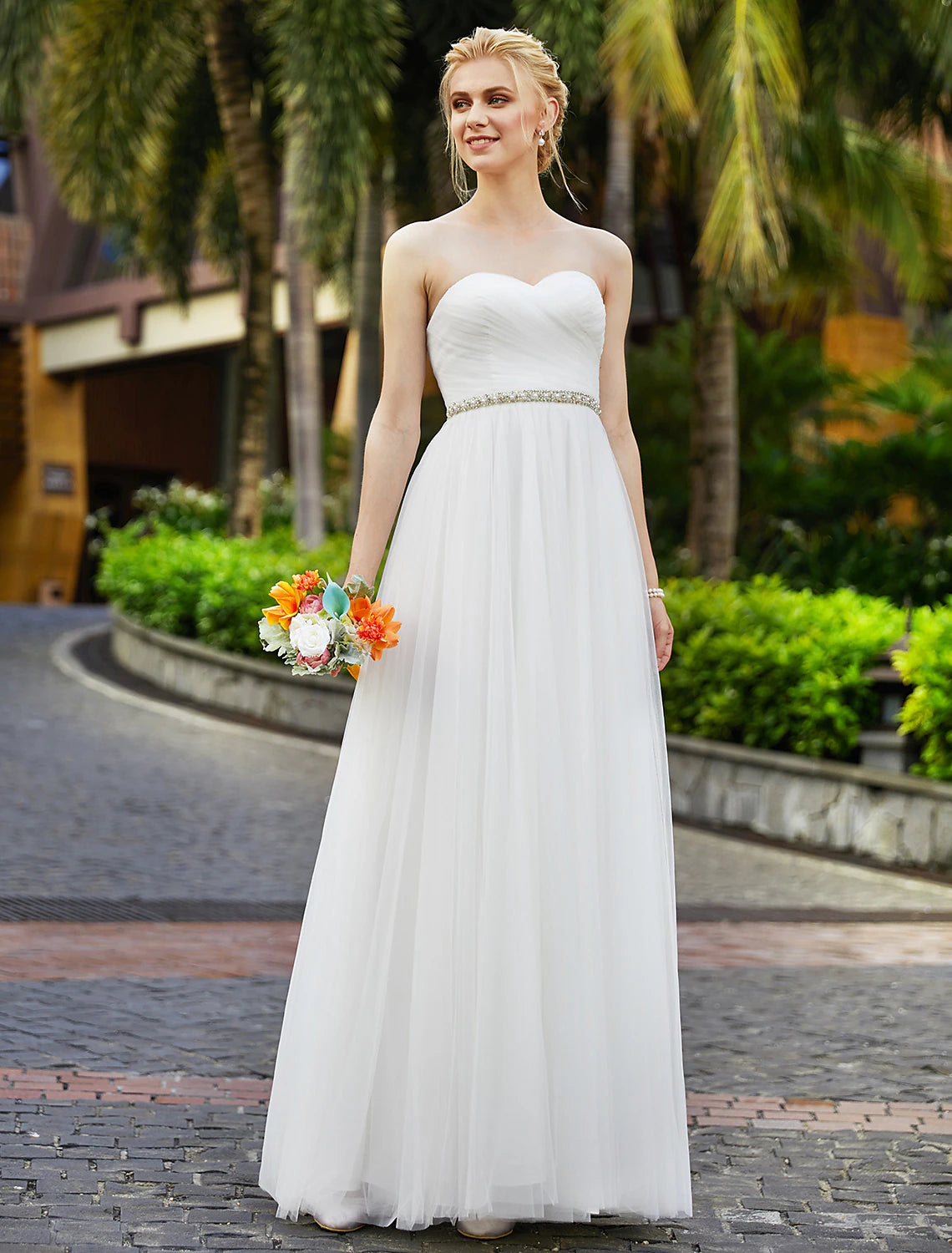 Floor length bridal gown featuring a sweetheart neckline.