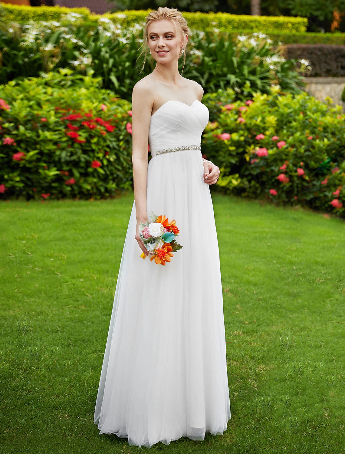 Elegant strapless wedding dress with delicate beading.
