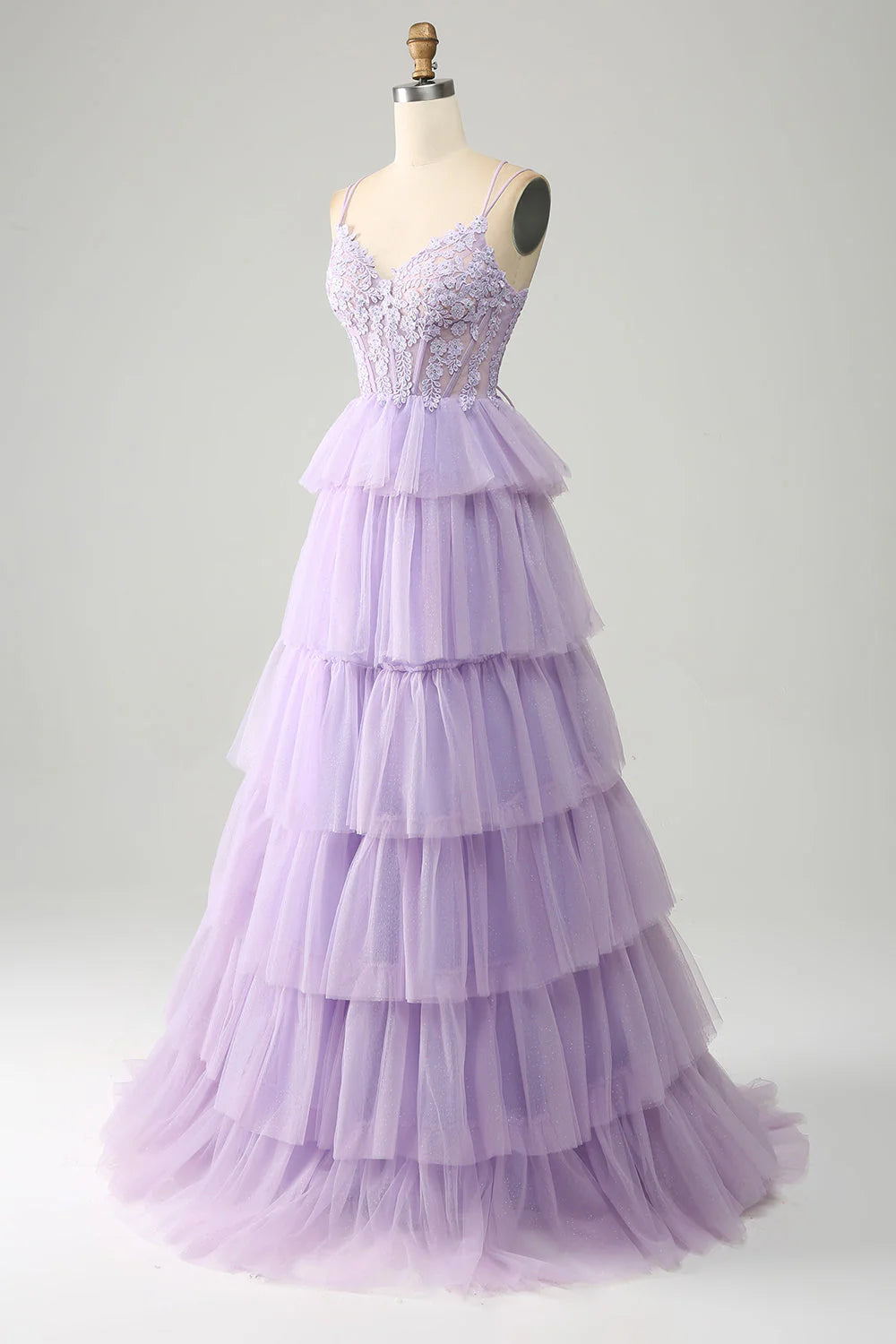 Back view of the lilac princess prom dress, showcasing the corset lacing and flowing tiered skirt.