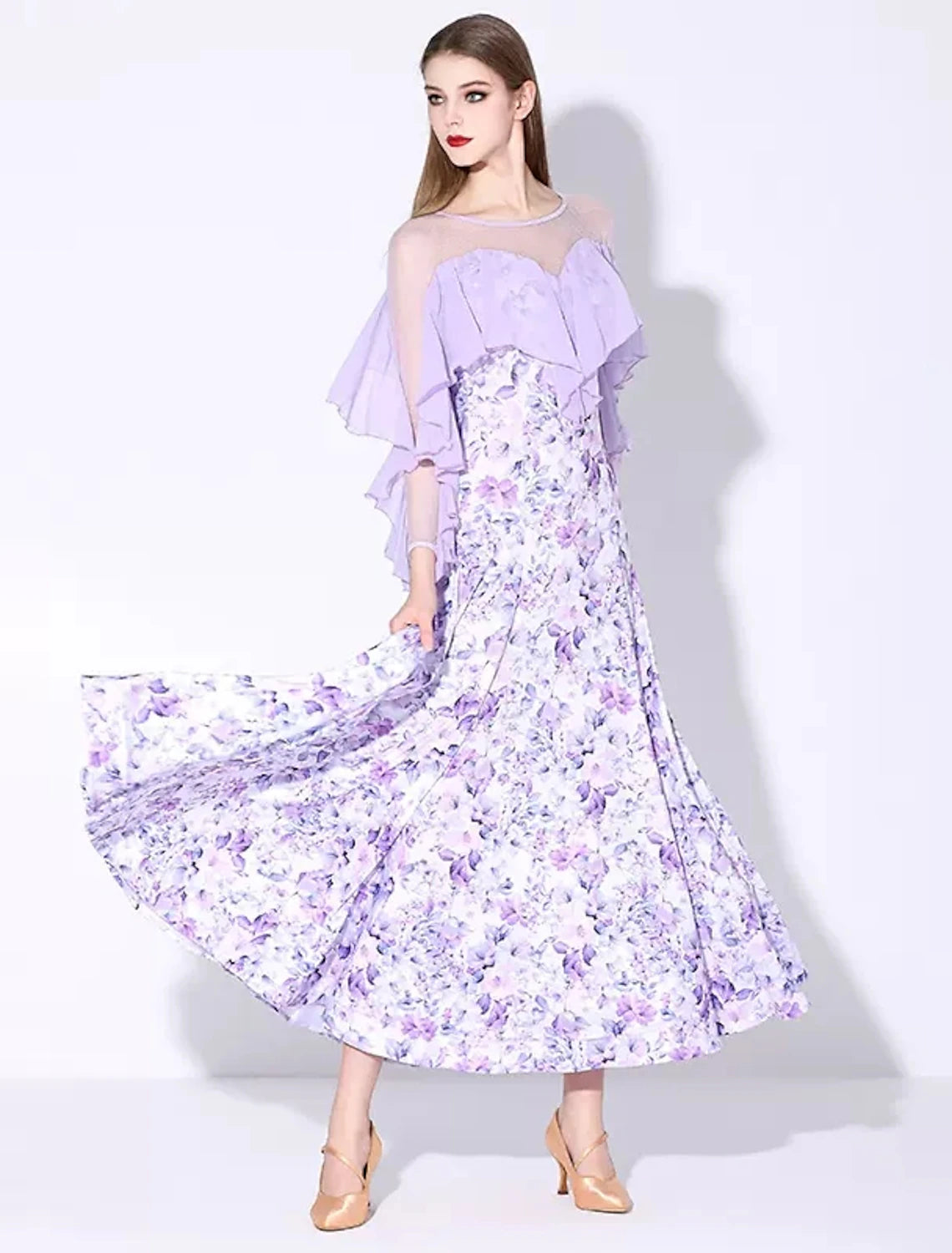 Woman wearing an elegant long sleeve ruffled printed ballroom dance dress.