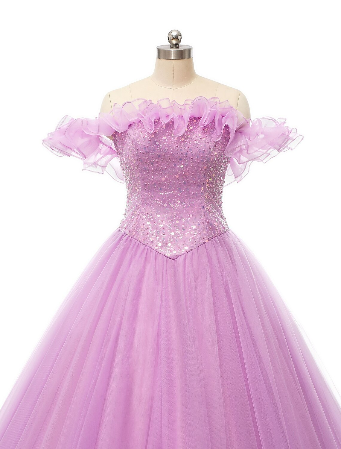 Side profile of the puffy off-shoulder prom dress.