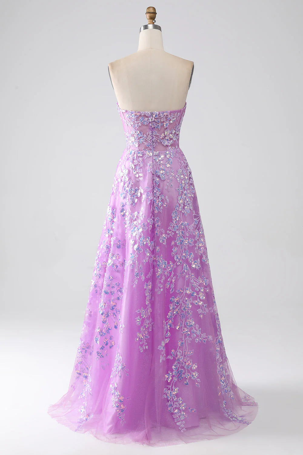 Close-up of appliques and corset bodice on a purple prom dress.