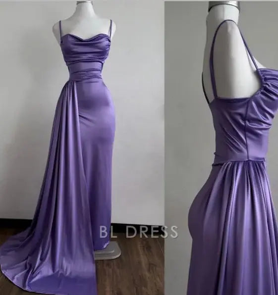 Model wearing a purple mermaid formal dress with sweetheart neckline and spaghetti straps.