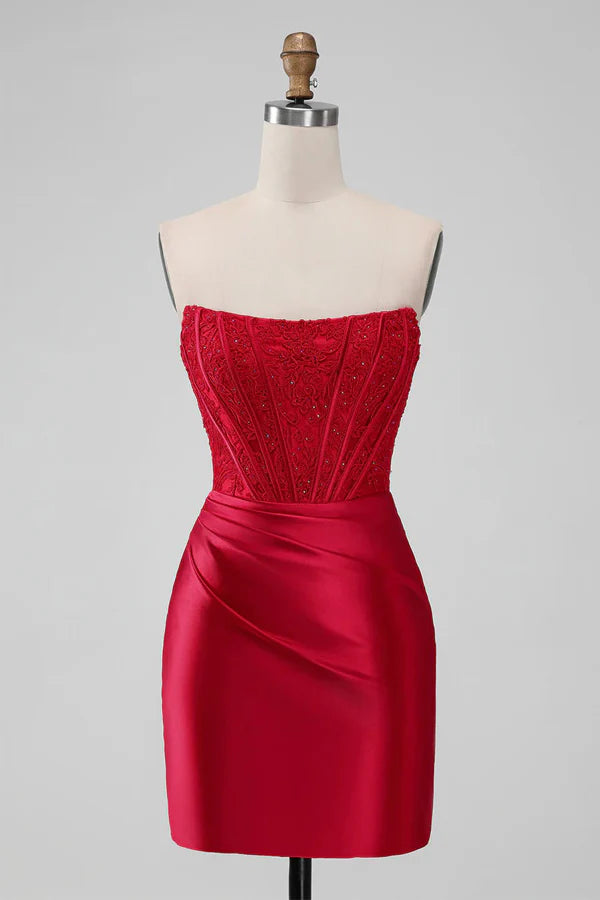 Model wearing a short red strapless A-line bodycon homecoming dress.