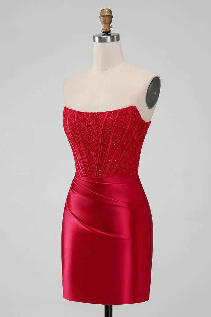 Close-up of the fabric and fit of the red strapless dress.