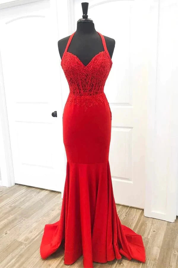 Elegant red satin mermaid prom dress with halter neckline and lace appliques.