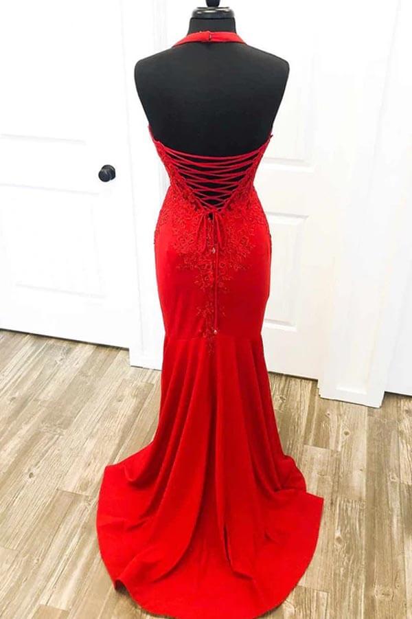 Side view of a red satin mermaid prom dress with halter neck.