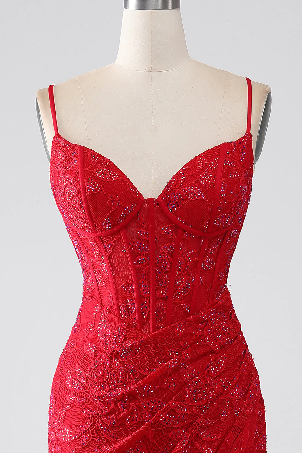 Side view of the red mermaid prom dress, highlighting the leg slit.