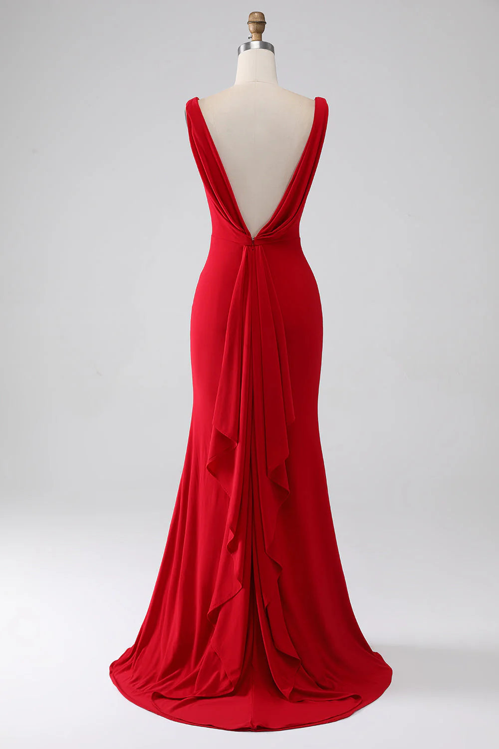 Red mermaid V-neck prom dress with a slit, side view.