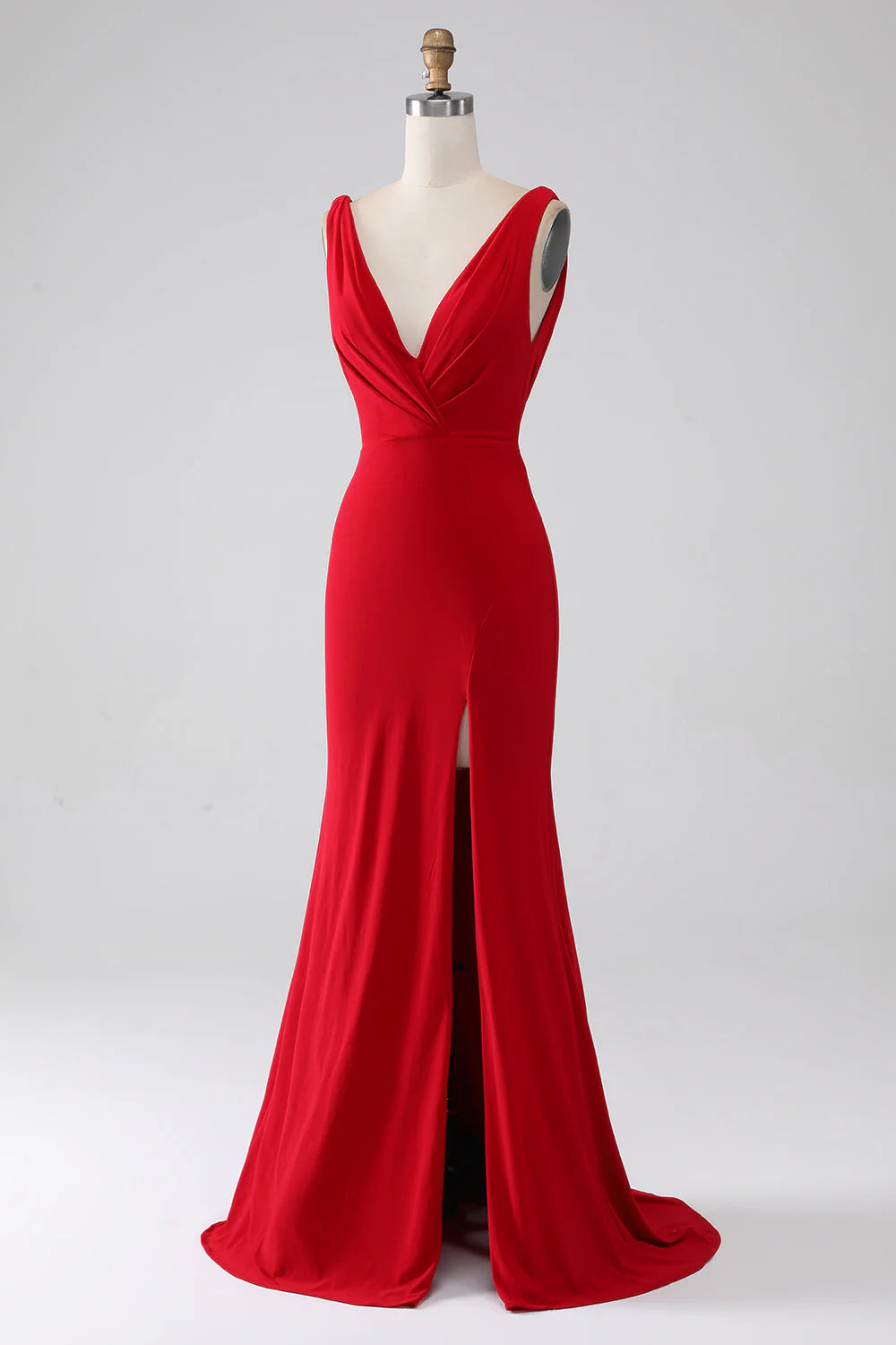 Red mermaid V-neck prom dress with a slit, back view.