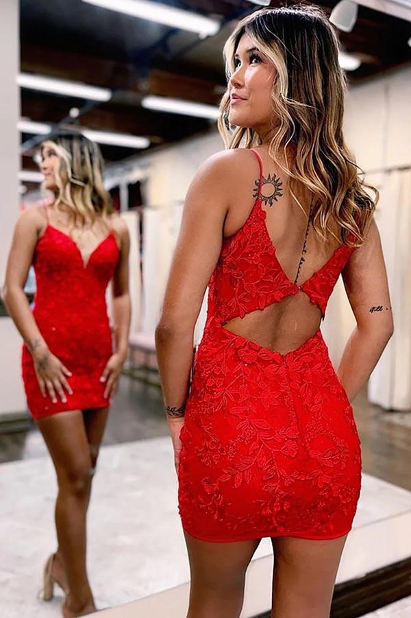 Back view of a red lace mermaid dress with spaghetti straps.