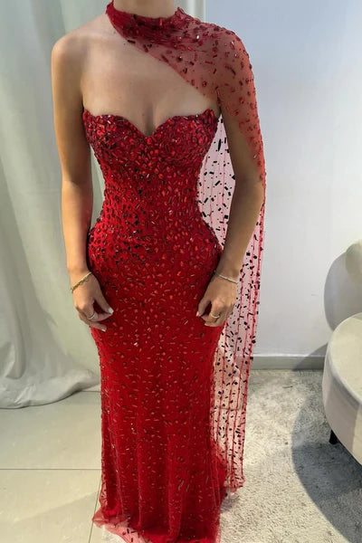 Close-up of the sweetheart neckline and intricate gemstone embellishments on the red dress.