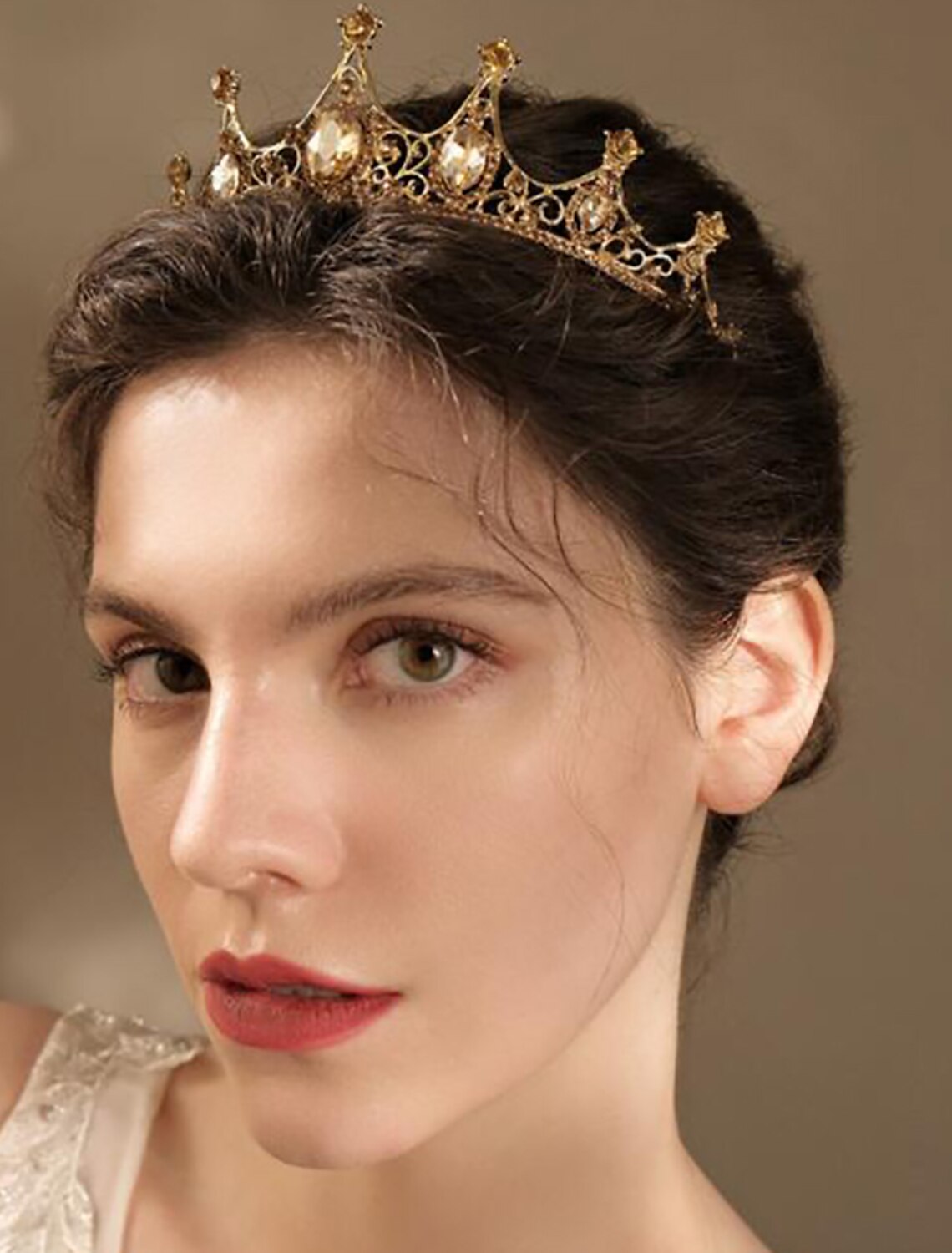 Bridal tiara with rhinestones worn by a model.