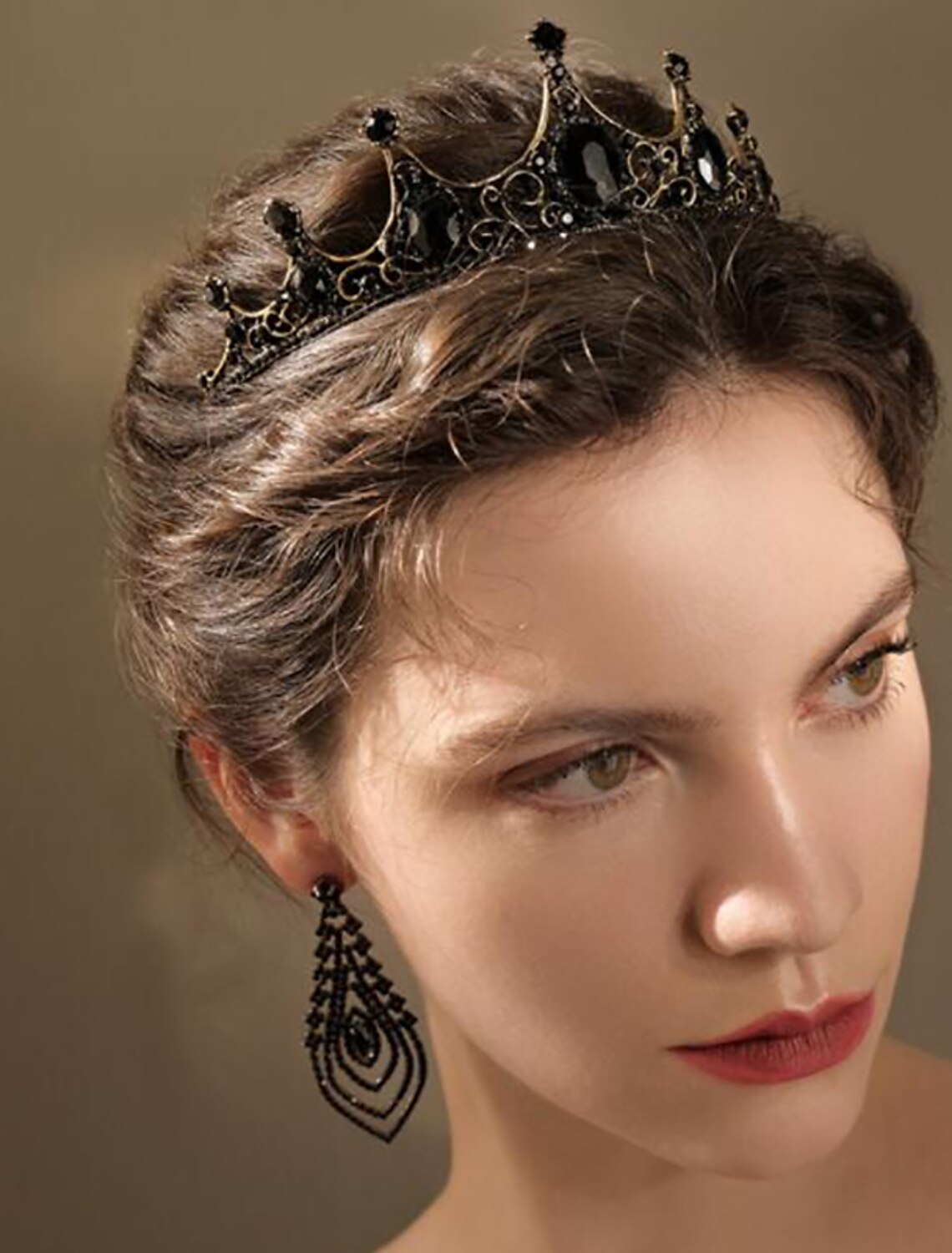 Close-up of intricate crystal and rhinestone details on a tiara.