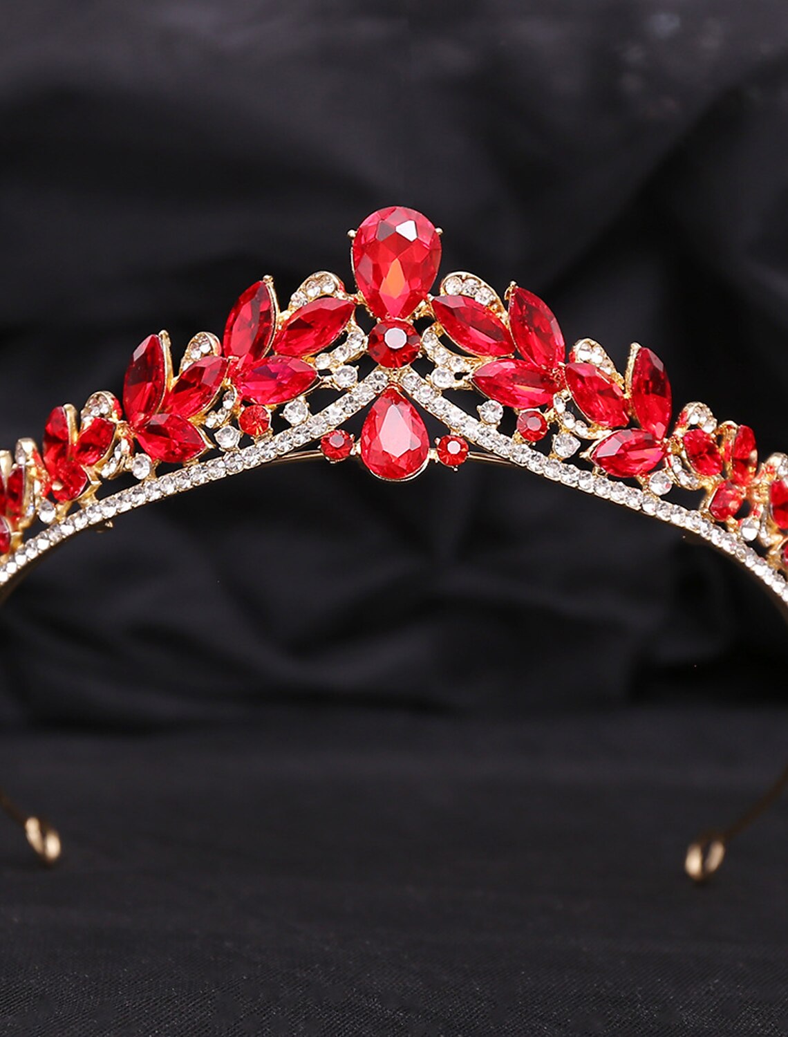 Elegant rhinestone alloy crown tiara headband worn by a model, showcasing its sparkling crystals.