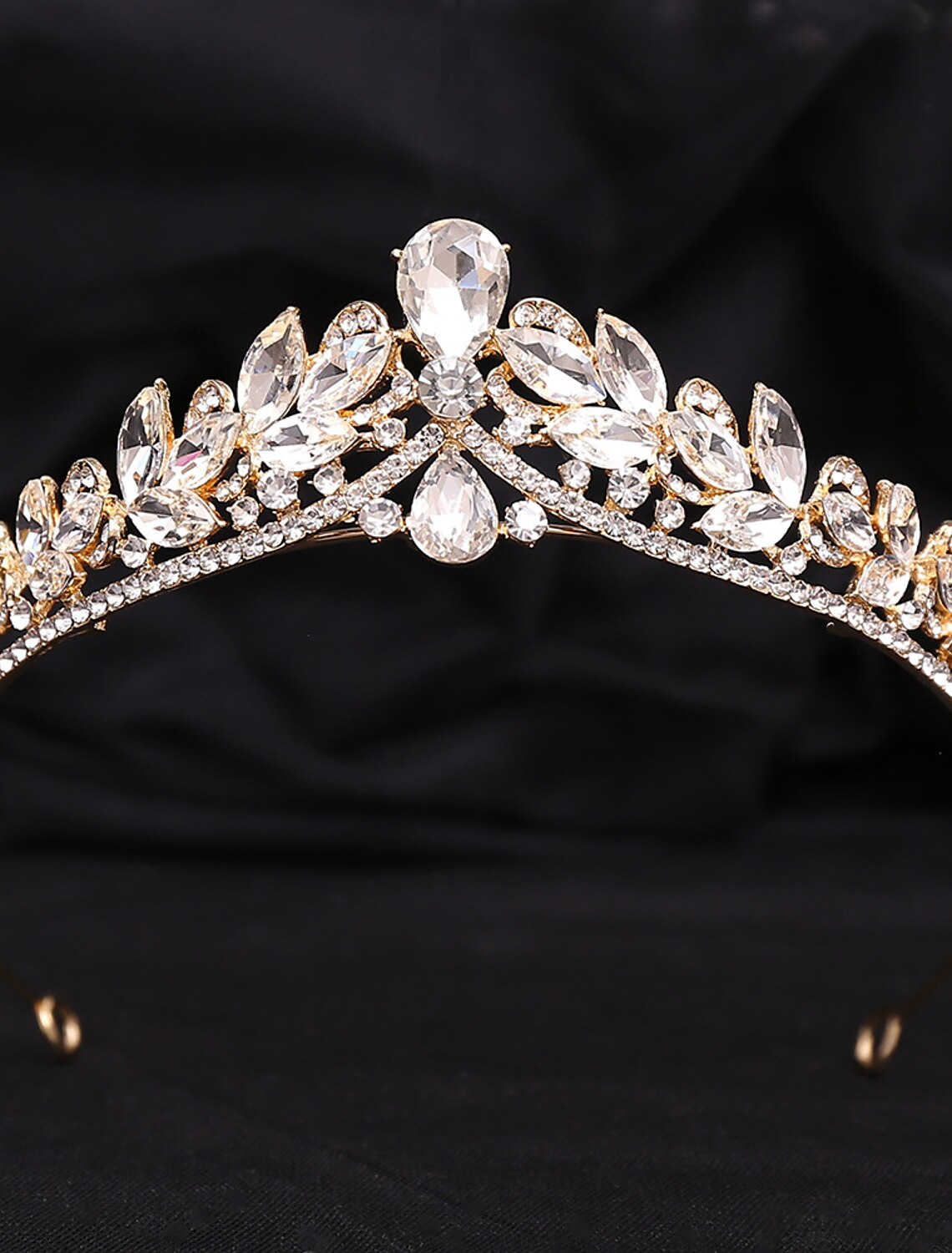 Side view of the elegant rhinestone alloy crown tiara headband on a model, complementing a formal hairstyle.