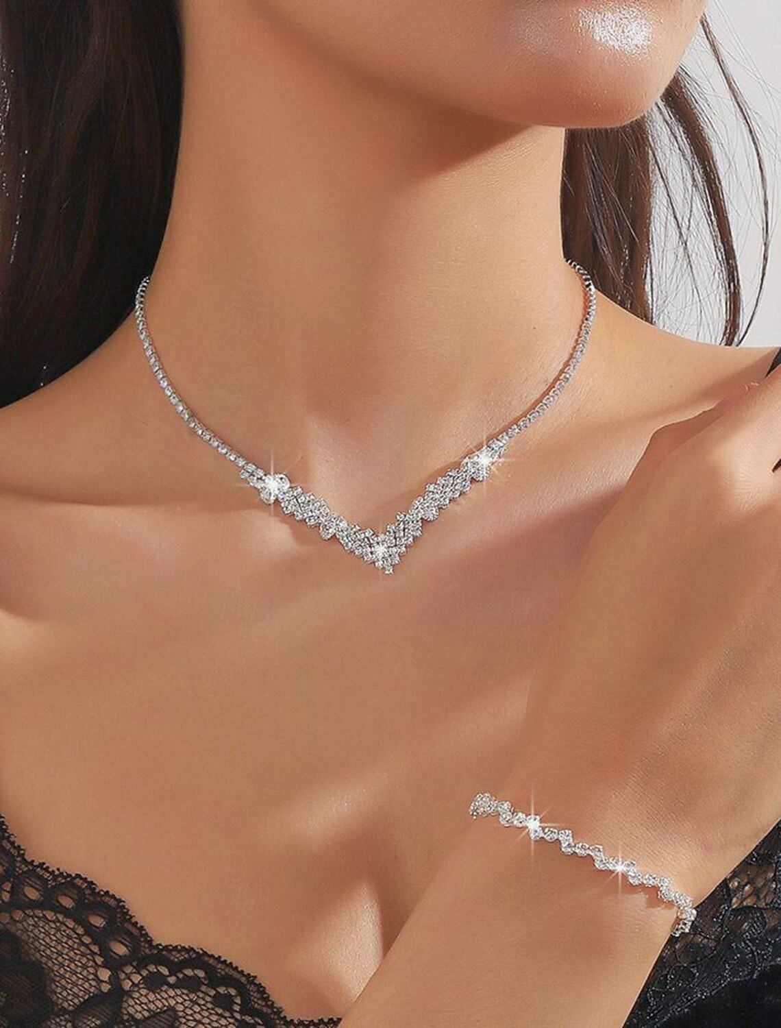 Close-up of geometric rhinestone alloy necklace.
