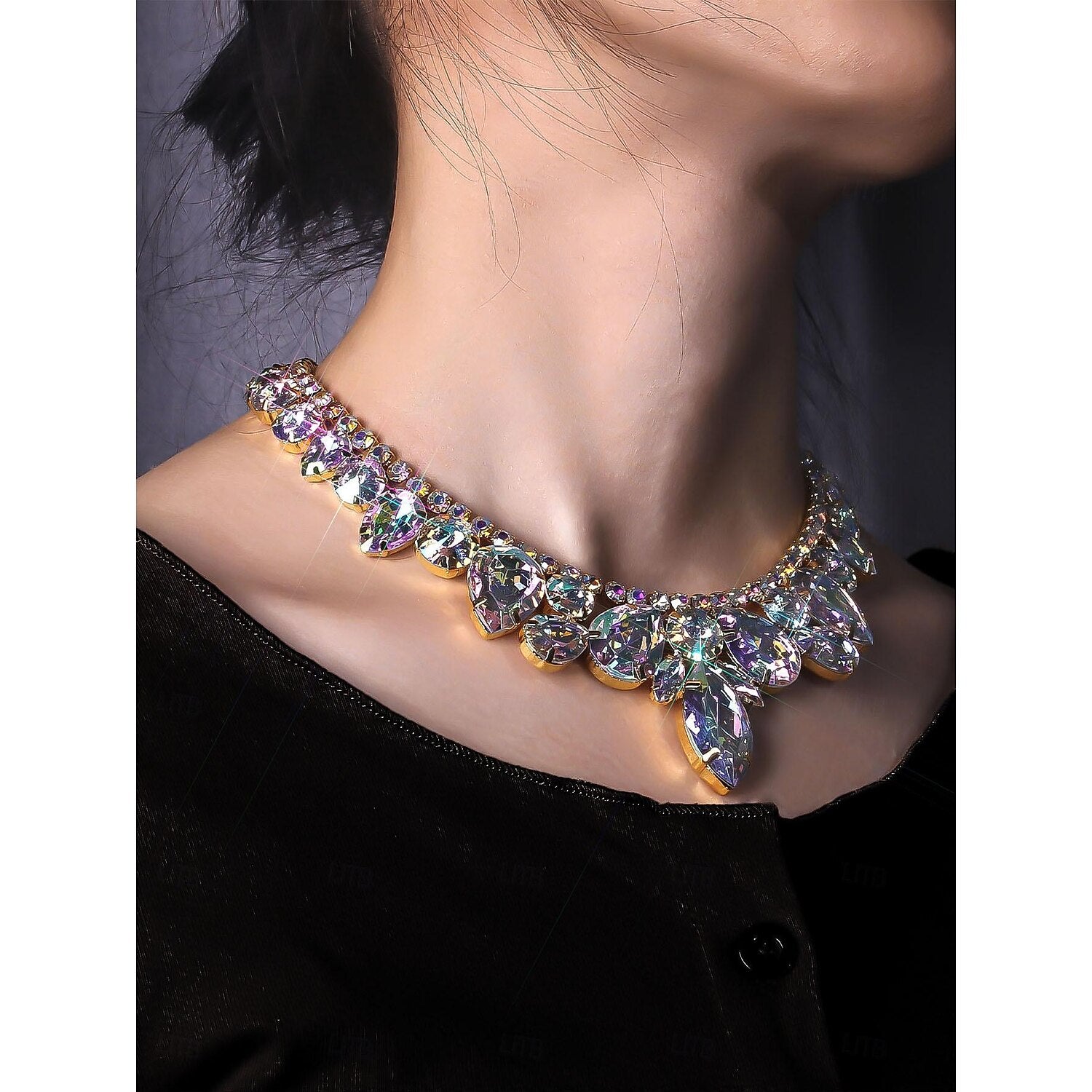 Close-up of an elegant irregular rhinestone and bead necklace.