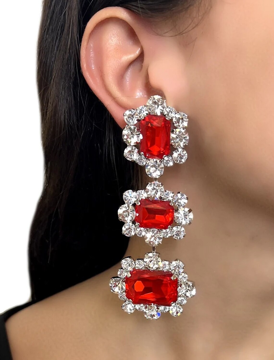 Close-up of a rhinestone necklace and matching drop earrings.