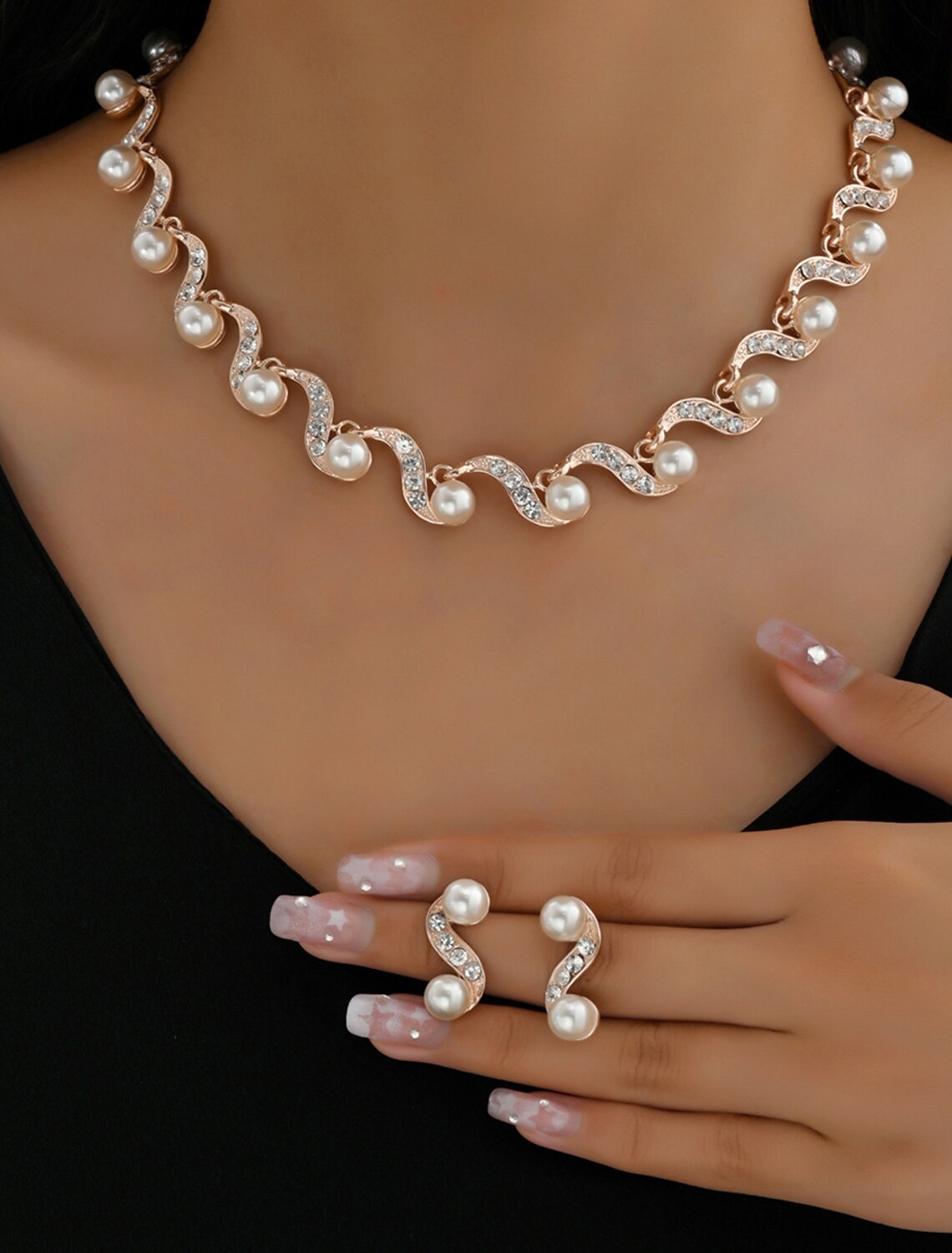 Side profile of a woman wearing the rhinestone bridal jewelry set, emphasizing its elegant drape.
