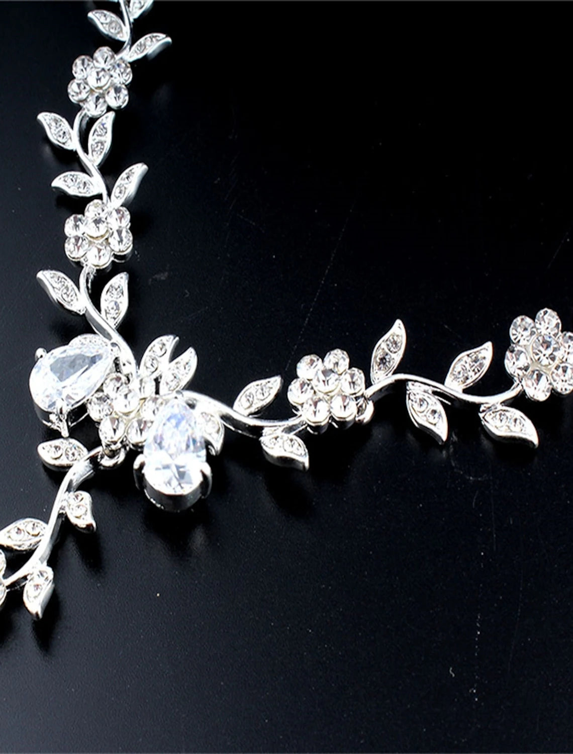 Rhinestone drop earrings from women's jewelry set.