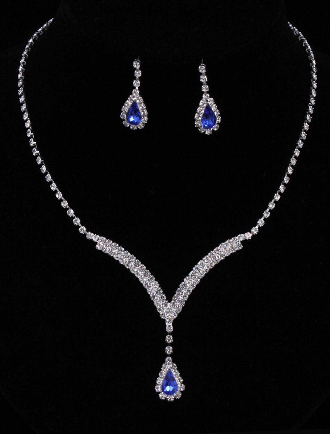Elegant rhinestone chandelier necklace and earrings set.