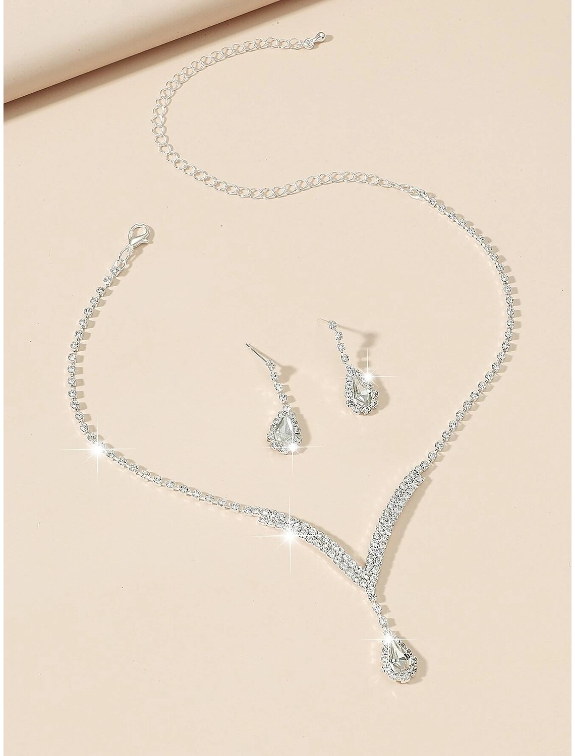 Rhinestone chandelier earrings with intricate detailing.