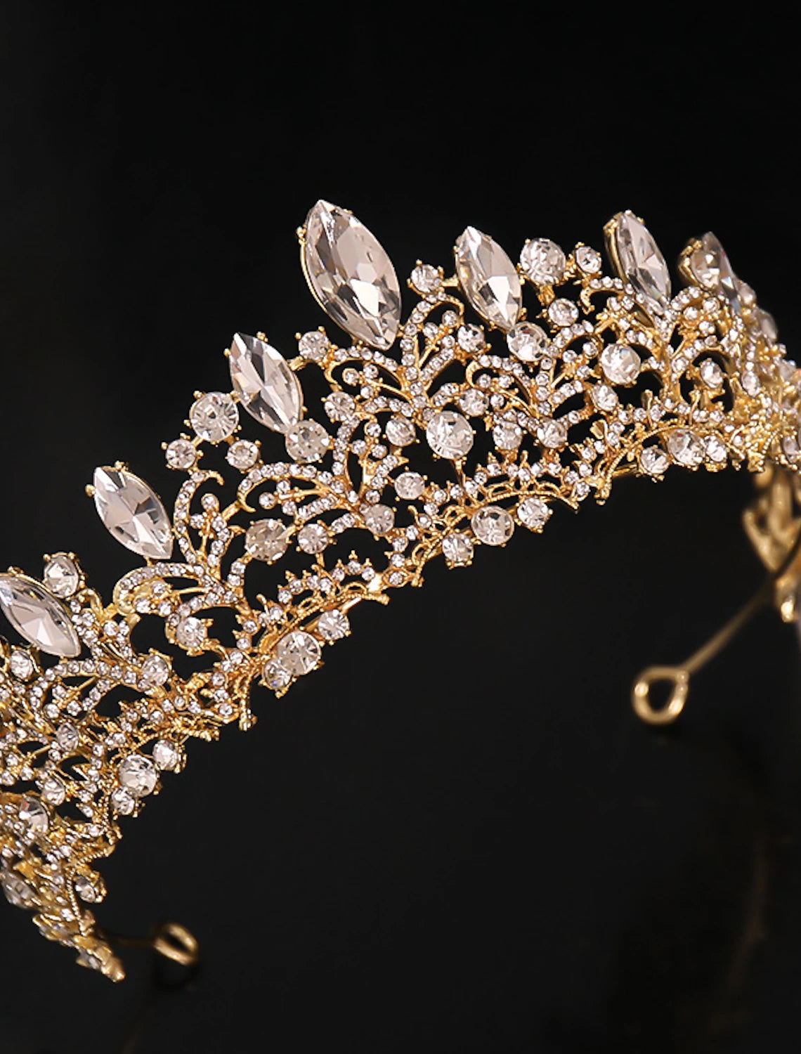 Close-up of rhinestone crystal details on a crown tiara headband.