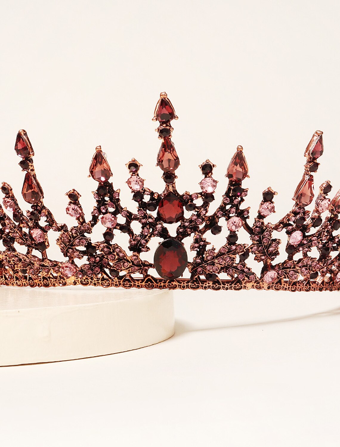 Side view of a sparkling crystal bridal headband with intricate design.