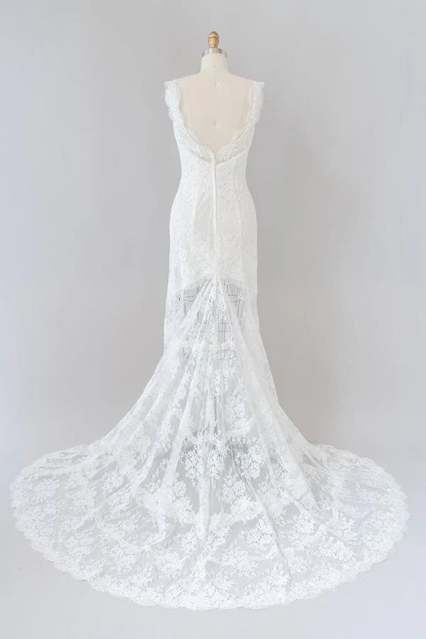 Side view of a romantic lace mermaid wedding dress.