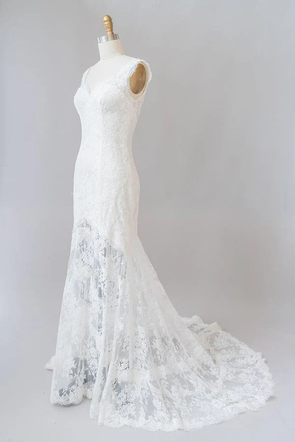 Close-up of lace details on a backless wedding dress.