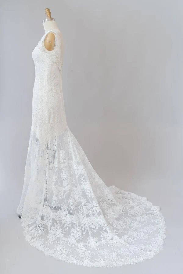 Back view of a mermaid wedding dress showcasing the lace and open back.