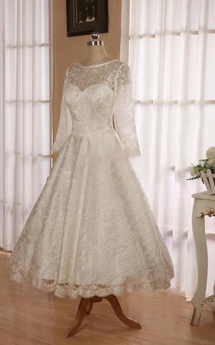 Model wearing an elegant tea length lace wedding dress.