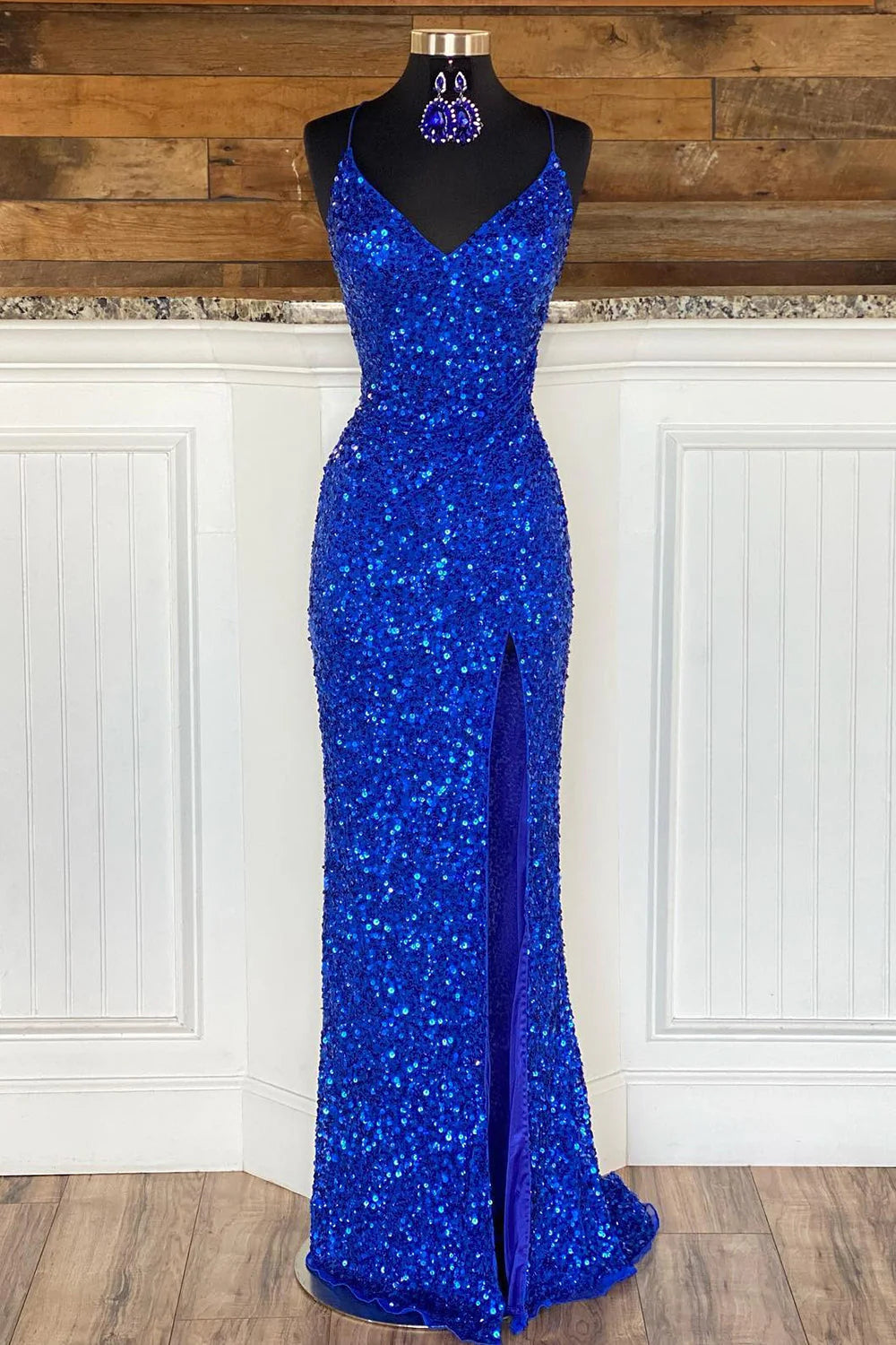 Elegant royal blue mermaid prom dress with spaghetti straps and sequin embellishments.