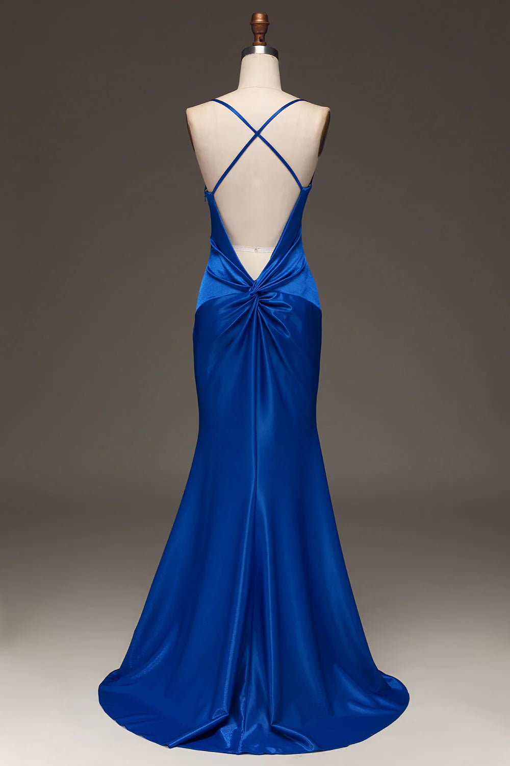 Royal blue mermaid satin prom dress, side view.