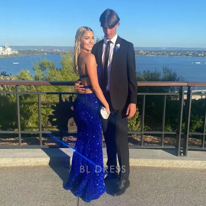Royal blue sequin mermaid formal dress with a V-neck and thigh-high split.