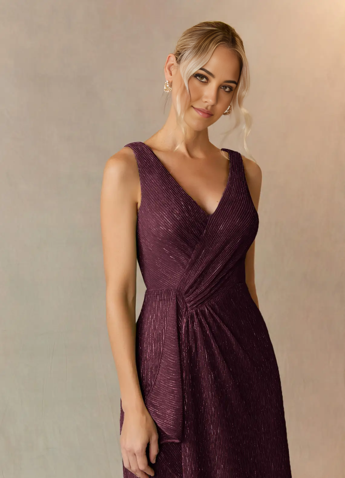 Close-up of the ruched detail on the mulberry V-neck dress.