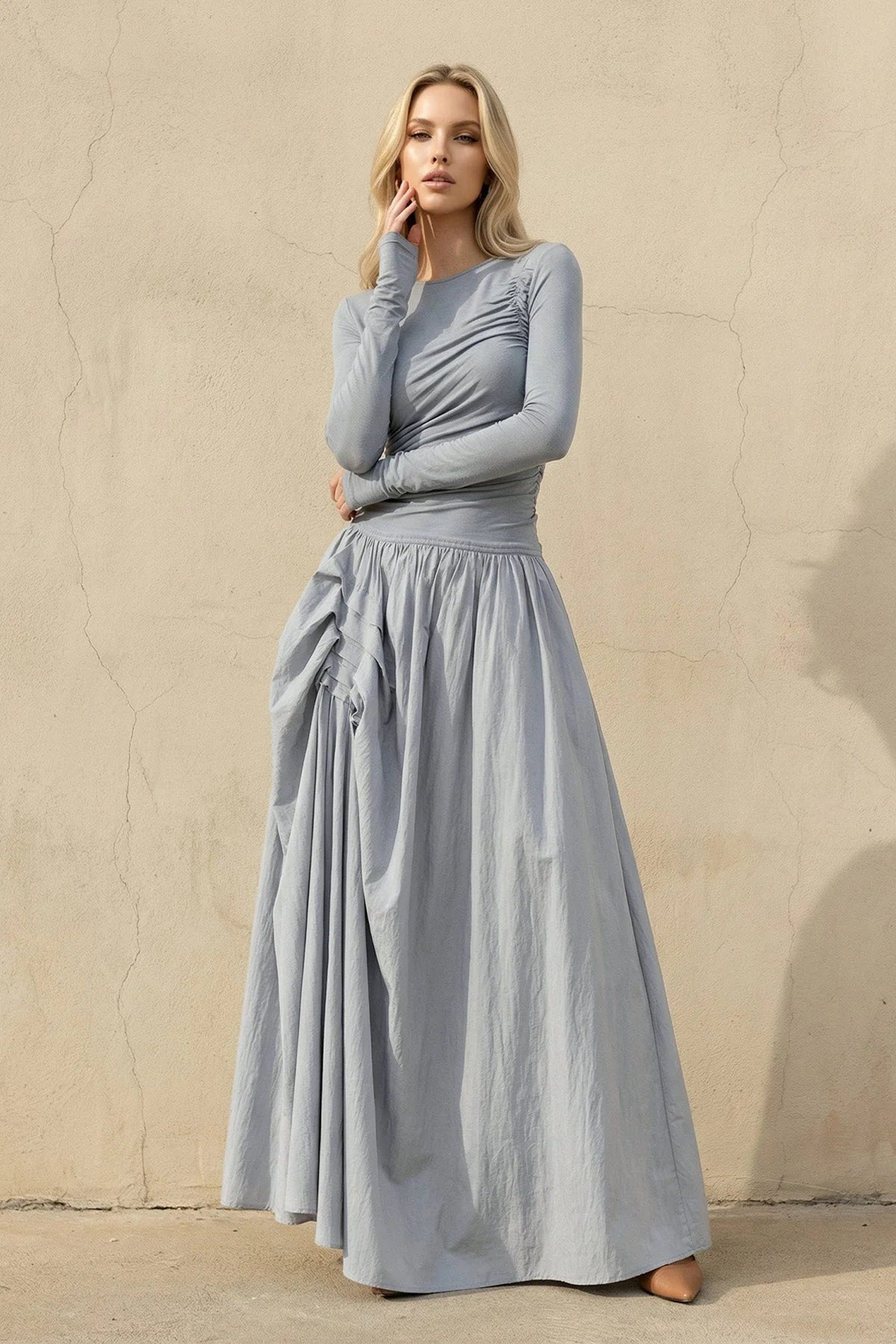 Close-up of the ruched bodice and square neckline on the velvet formal gown.