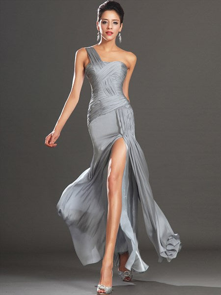 Model wearing a grey one-shoulder ruched sheath long prom dress with a side split.