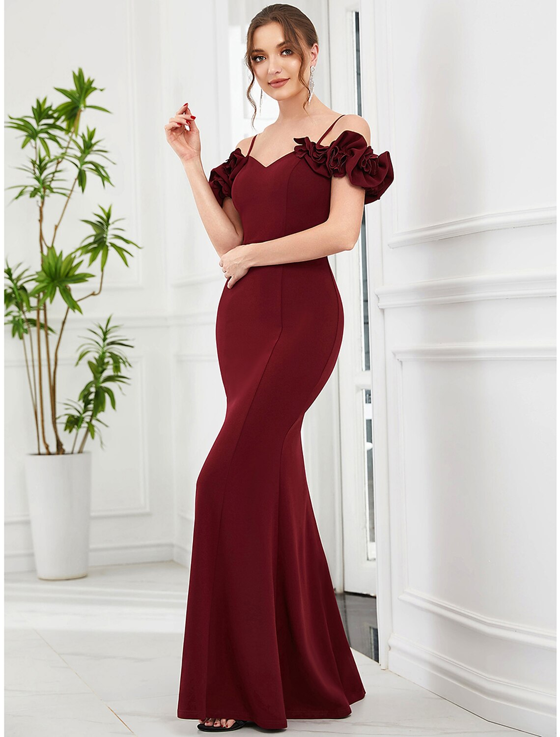 Elegant off-shoulder Mermaid Trumpet evening gown with ruffles.