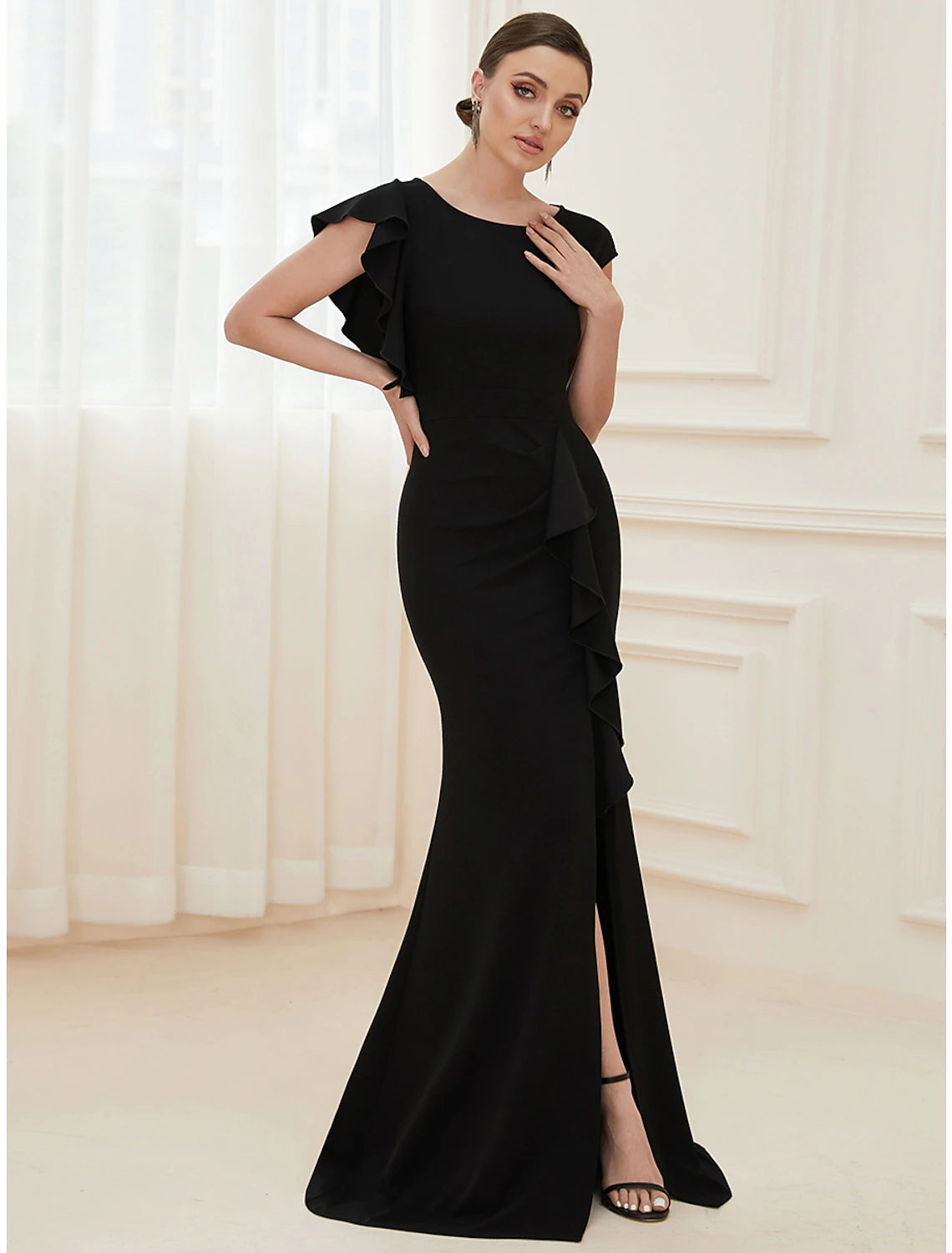 Elegant mermaid trumpet evening gown with jewel neck and short sleeves.