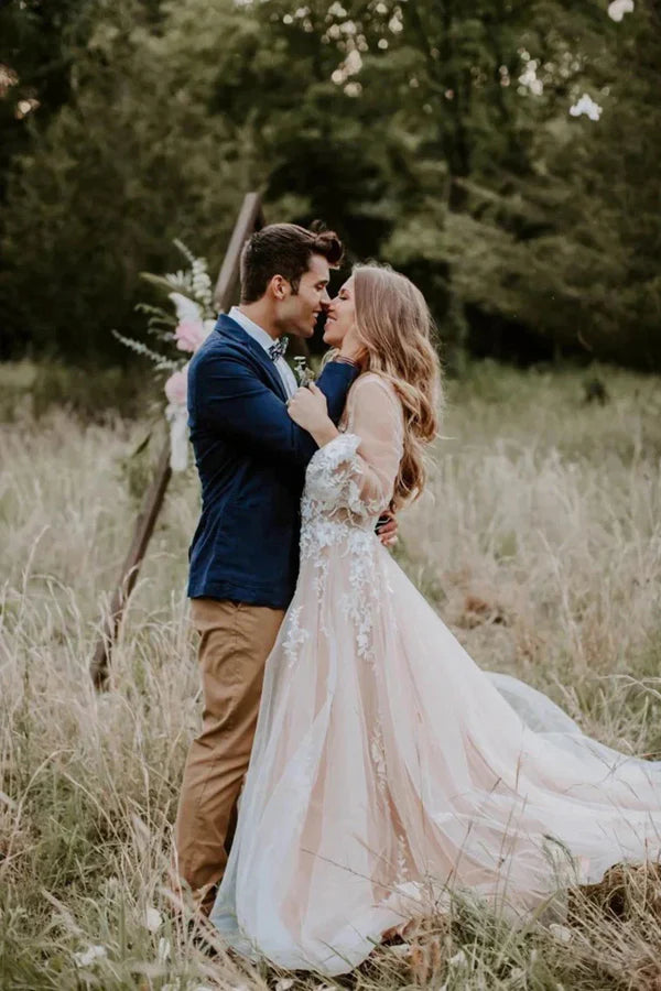 Close-up of the V-neck and long sleeves on the rustic wedding dress.
