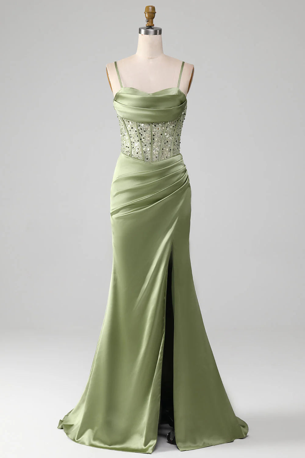 Sage mermaid prom dress with spaghetti straps and corset bodice.
