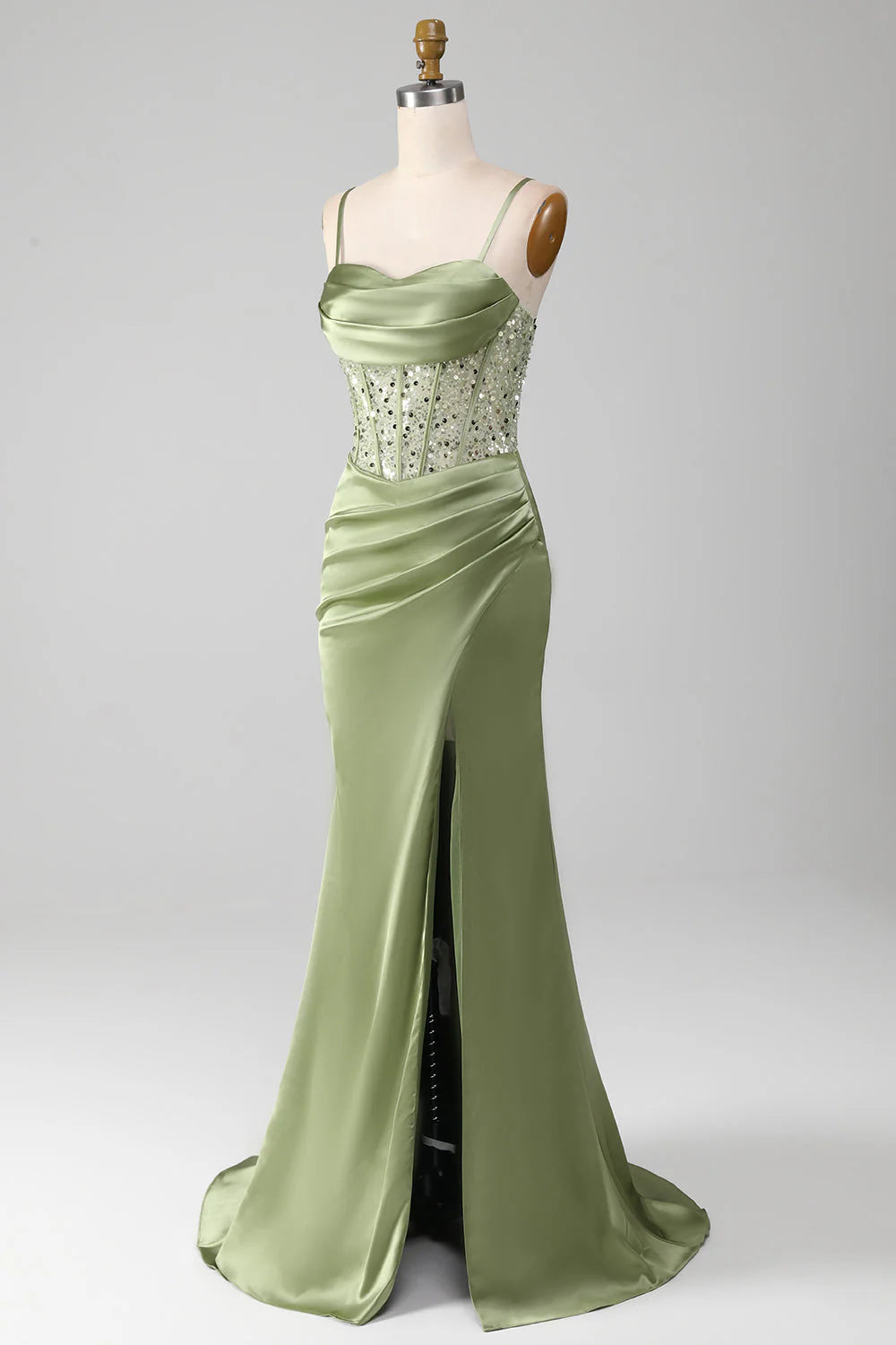 Side view of sage mermaid prom dress with a high split front.