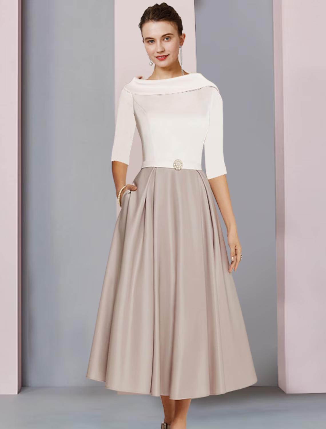 Elegant A-line satin tea-length dress with scoop neck, half sleeves, pleats, and crystal brooch.